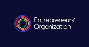 A logo on a dark blue background featuring the text "Entrepreneurs' Organization" in white. On the left, there is a circular design made of multiple rings in various colors, including blue, purple, red, orange, yellow, and green—perfect for businesses in IT Services.