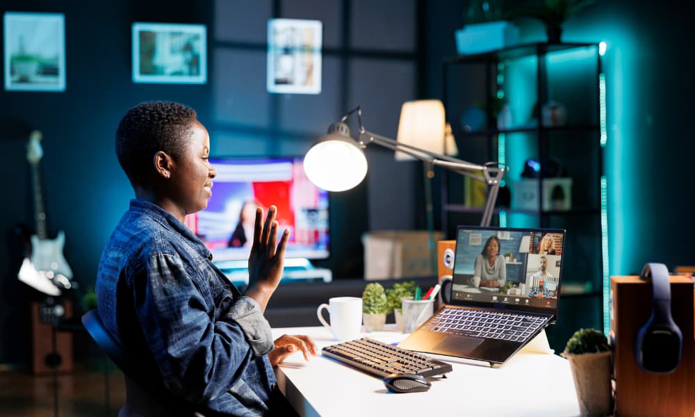 Worker at home receives remote I.T. support while working remotely.