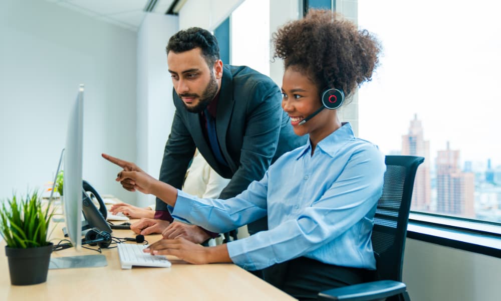 Workers using VoIP for business on computer