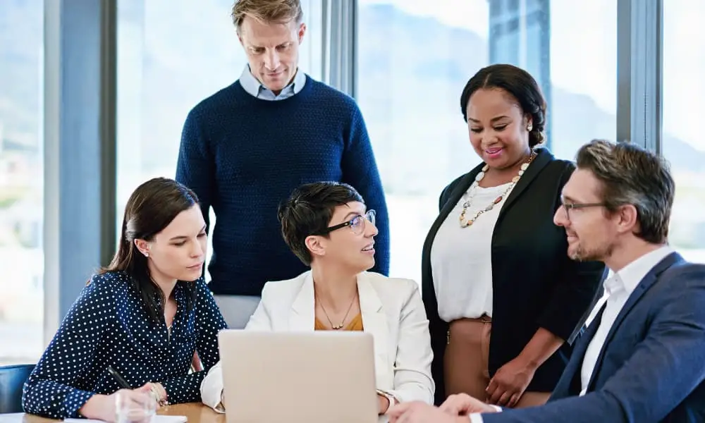 Business and I.T. teams discussing data backup compliance best practices.