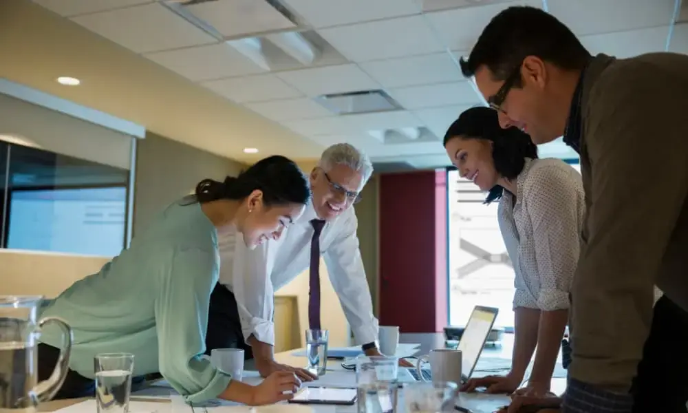 Four business executives discussing I.T. projects.